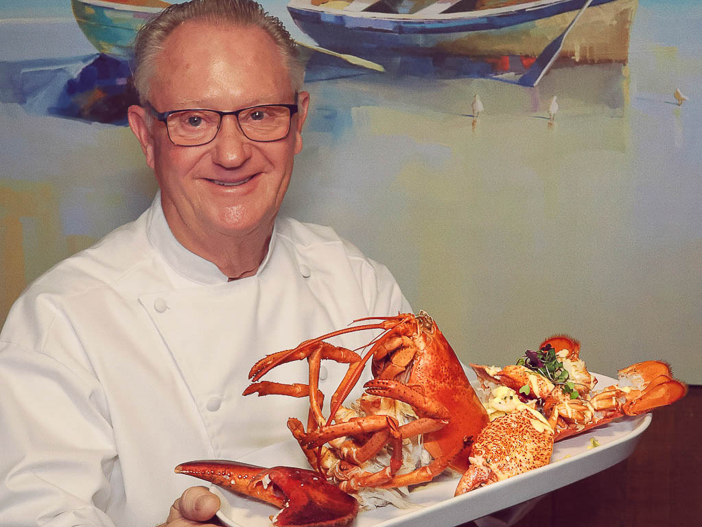 Owner Chef Mike Rumplik with Lazy Man_s Lobstah. Best seafood in Orlando.