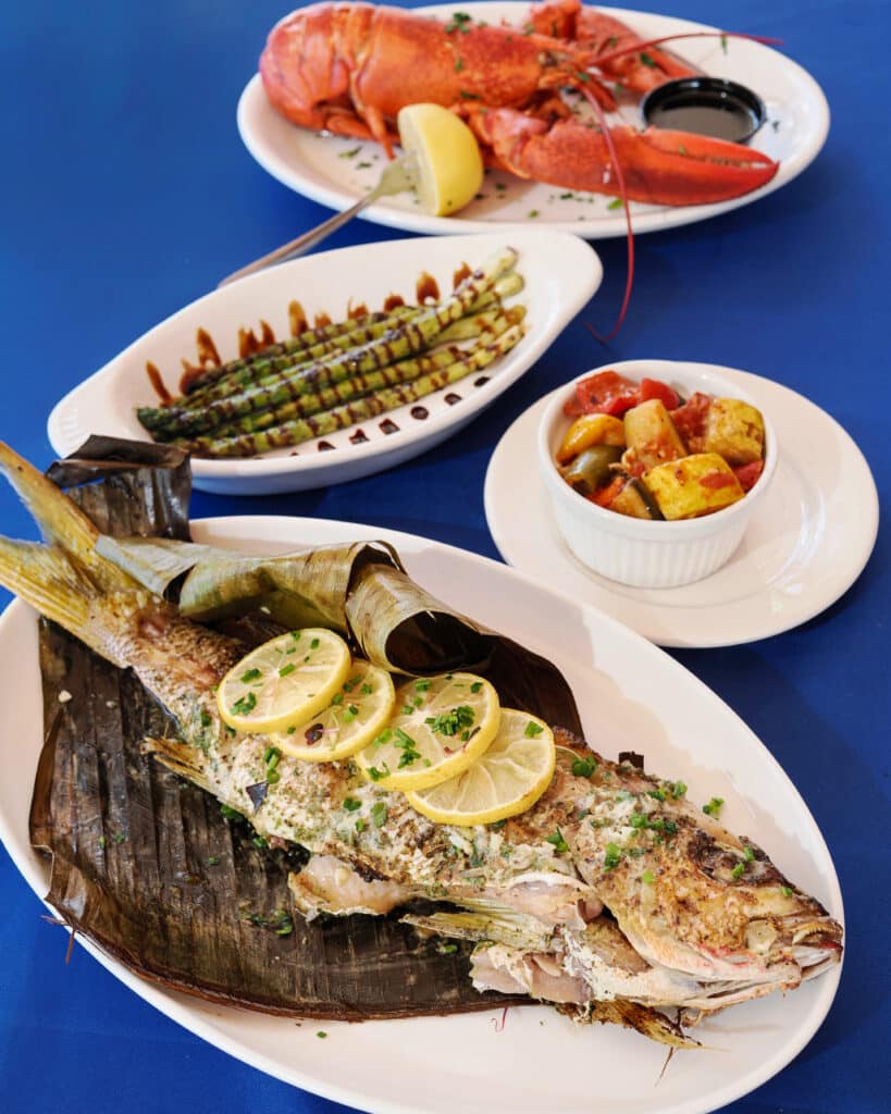 The seafood menu at The Nauti Lobstah features fresh Maine Lobster and wild-caught fish including whole yellowtail snapper baked in banana leaf, one of the best wild-caught fish dishes in Orlando